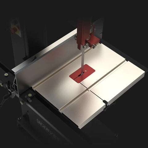 View looking down at the nickel-coated work table and fence on the Alpha HW615Pro bandsaw on a dark background. 